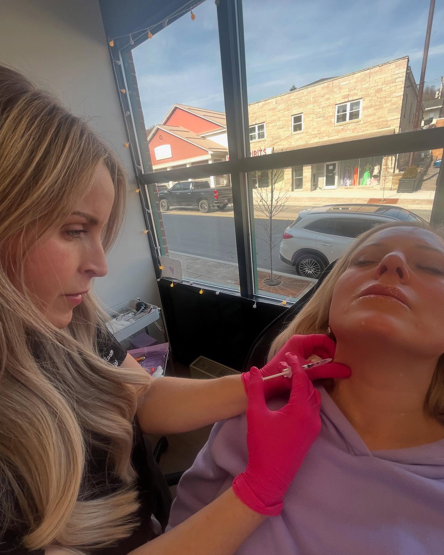 Brandy injects a client's next